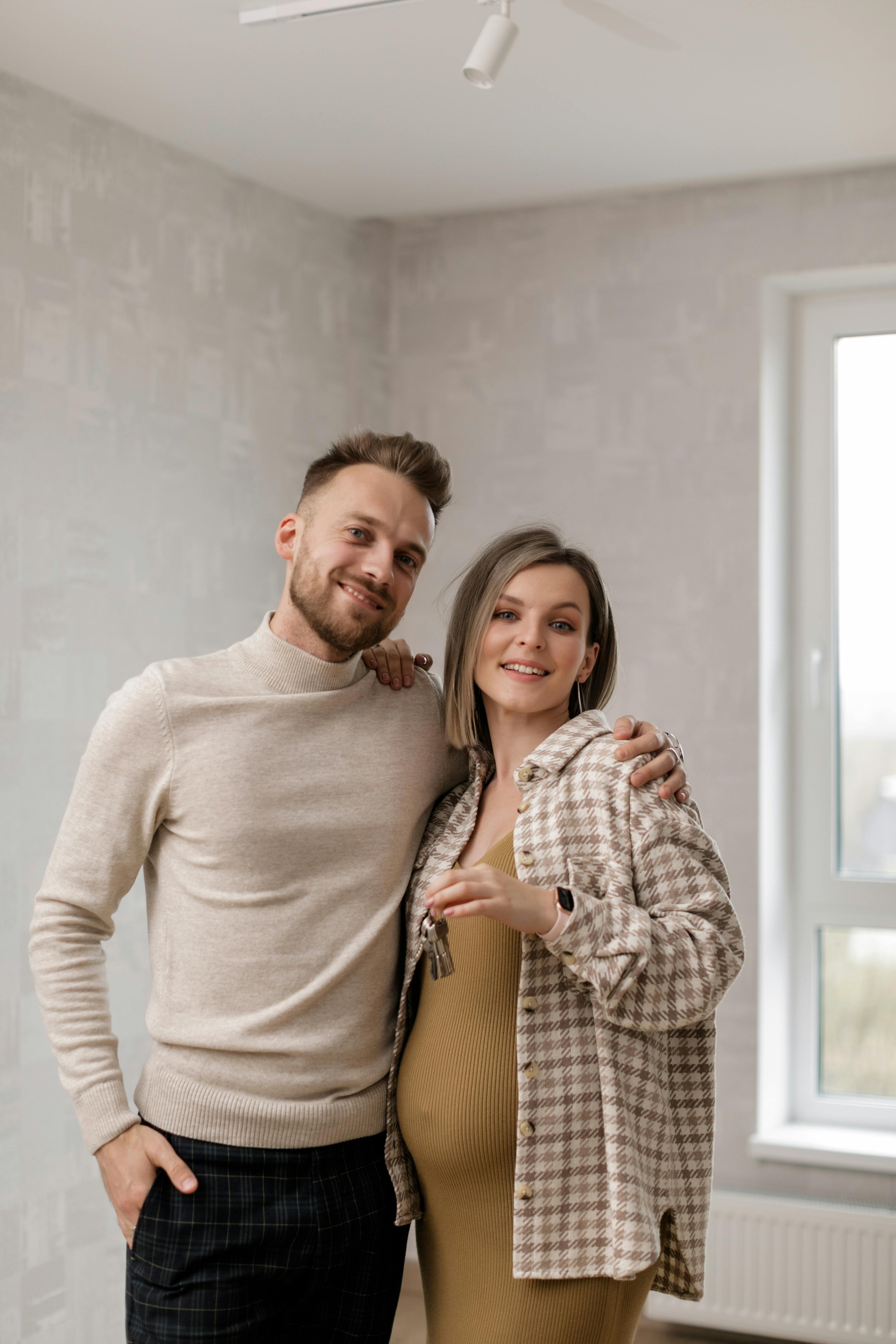 Couple celebrating in new property